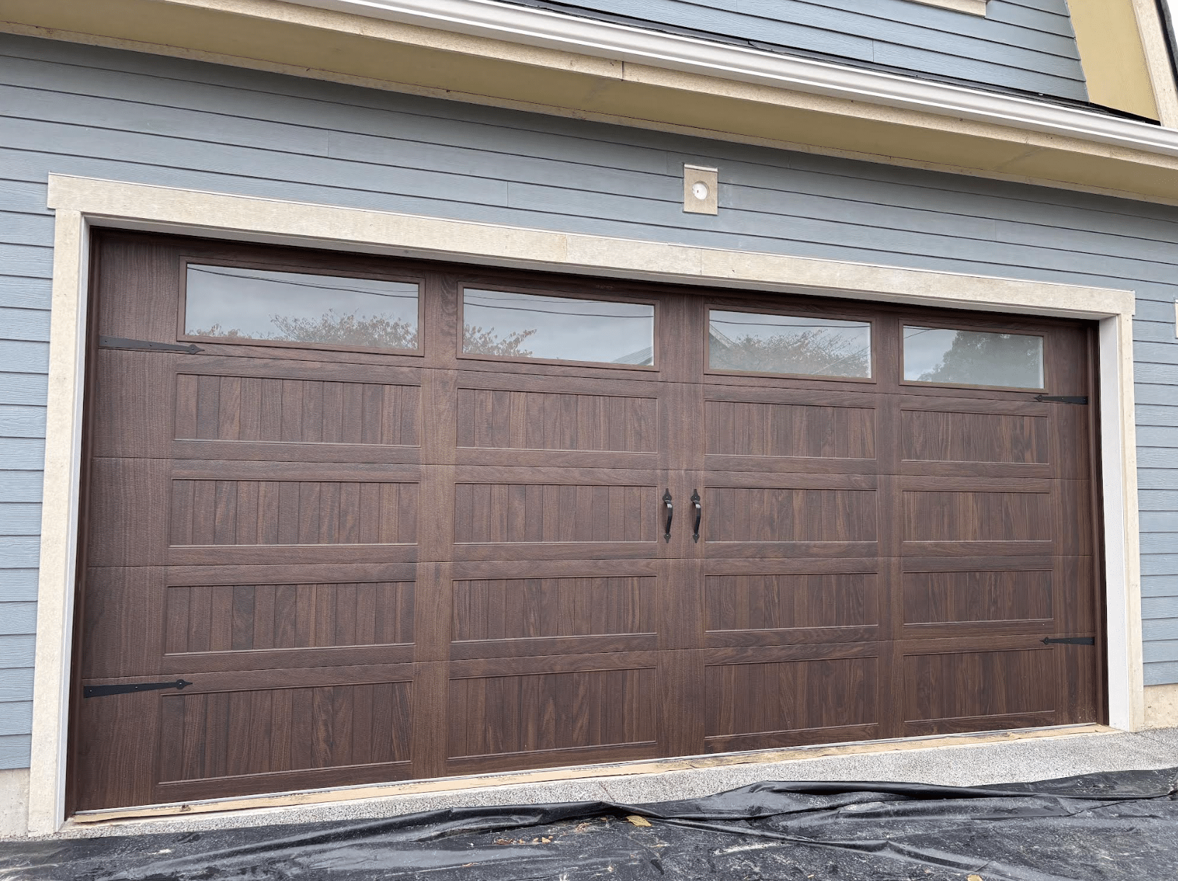 Brown garage door installed on a home in Everett.